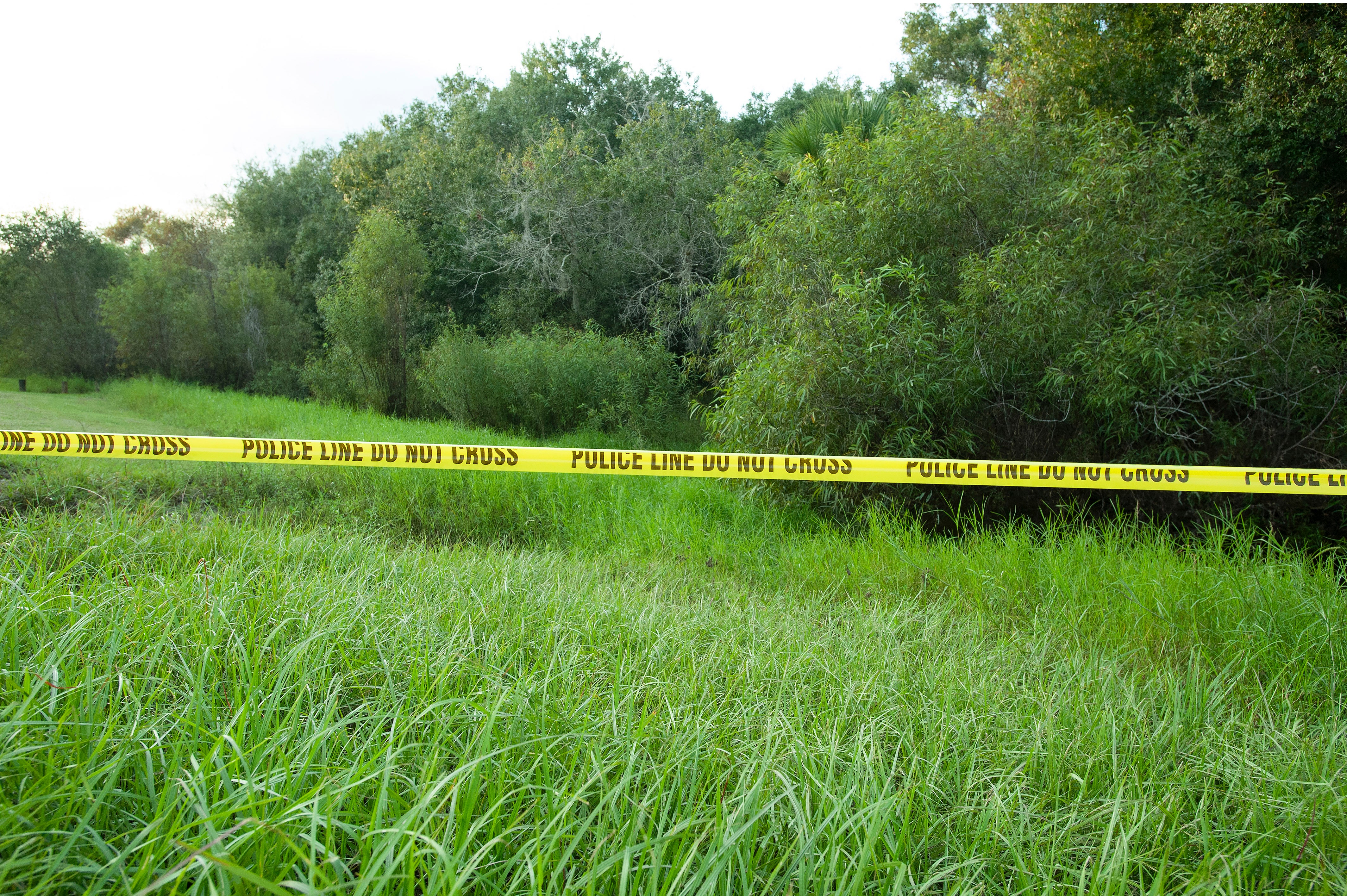 Police tape restricts access to Myakkahatchee Creek Environmental Park on 20 October 2021 in North Port, Florida. The FBI announced human remains and personal items belonging to Brian Laundrie have been found there