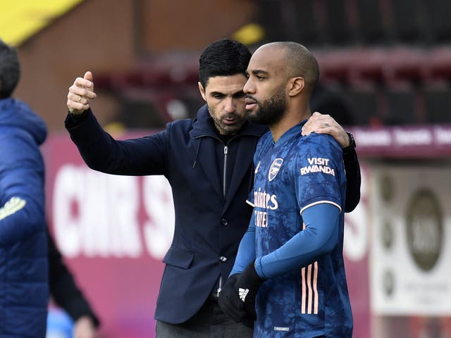 Arsenal manager Mikel Arteta, left, has spoken on Alexandre Lacazette’s contract issue (Peter Powell/PA)