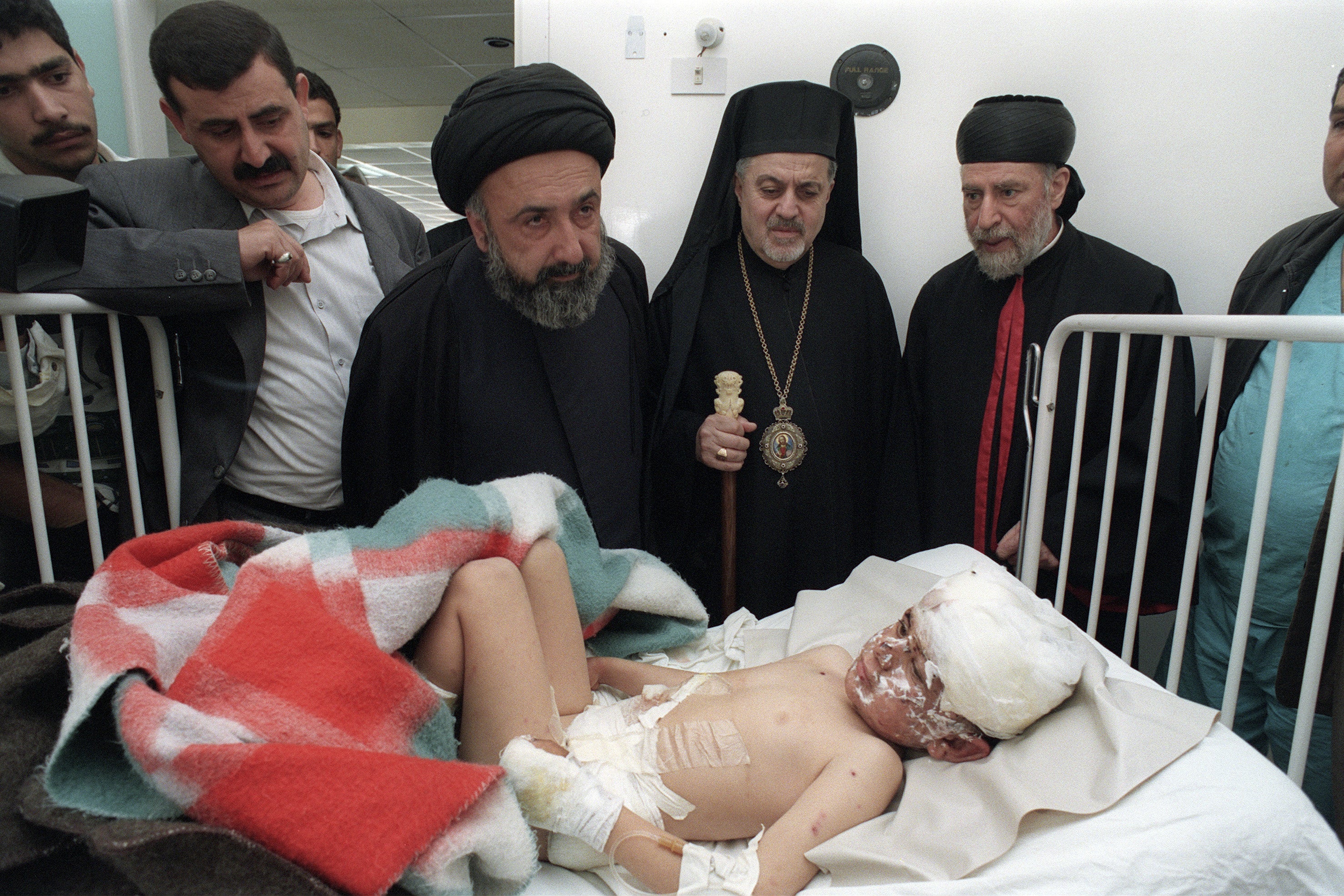 Lebanese Muslim and Christian clerics pay a visit on 19 April 1996 to Tyre hospital to meet survivors of the Qana massacre, when Israeli artillery shelled the United Nation compound