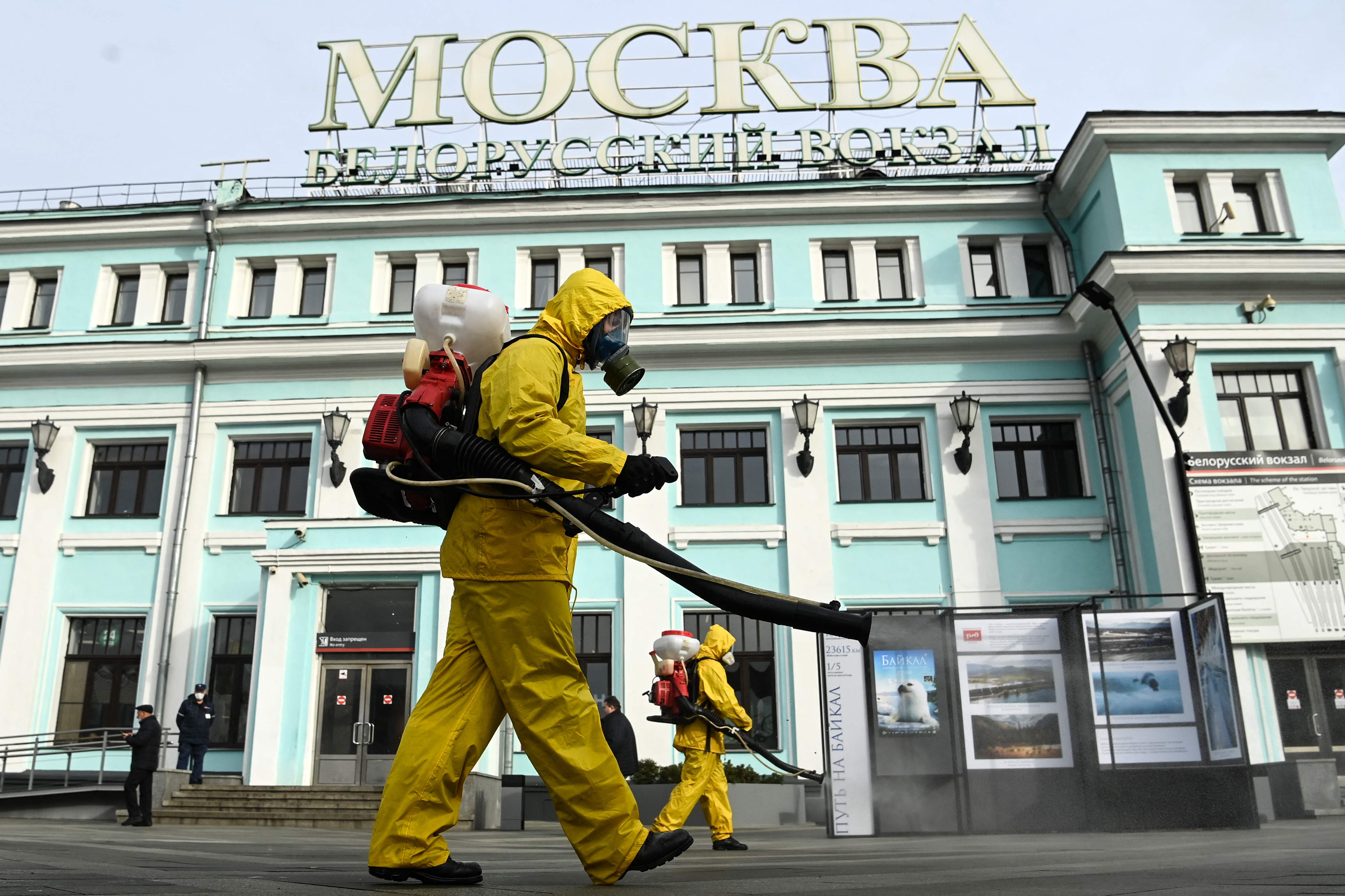 Workers from Russia’s Emergencies Ministry, wearing protective gear, disinfect Moscow’s Belorussky railway station earlier this week