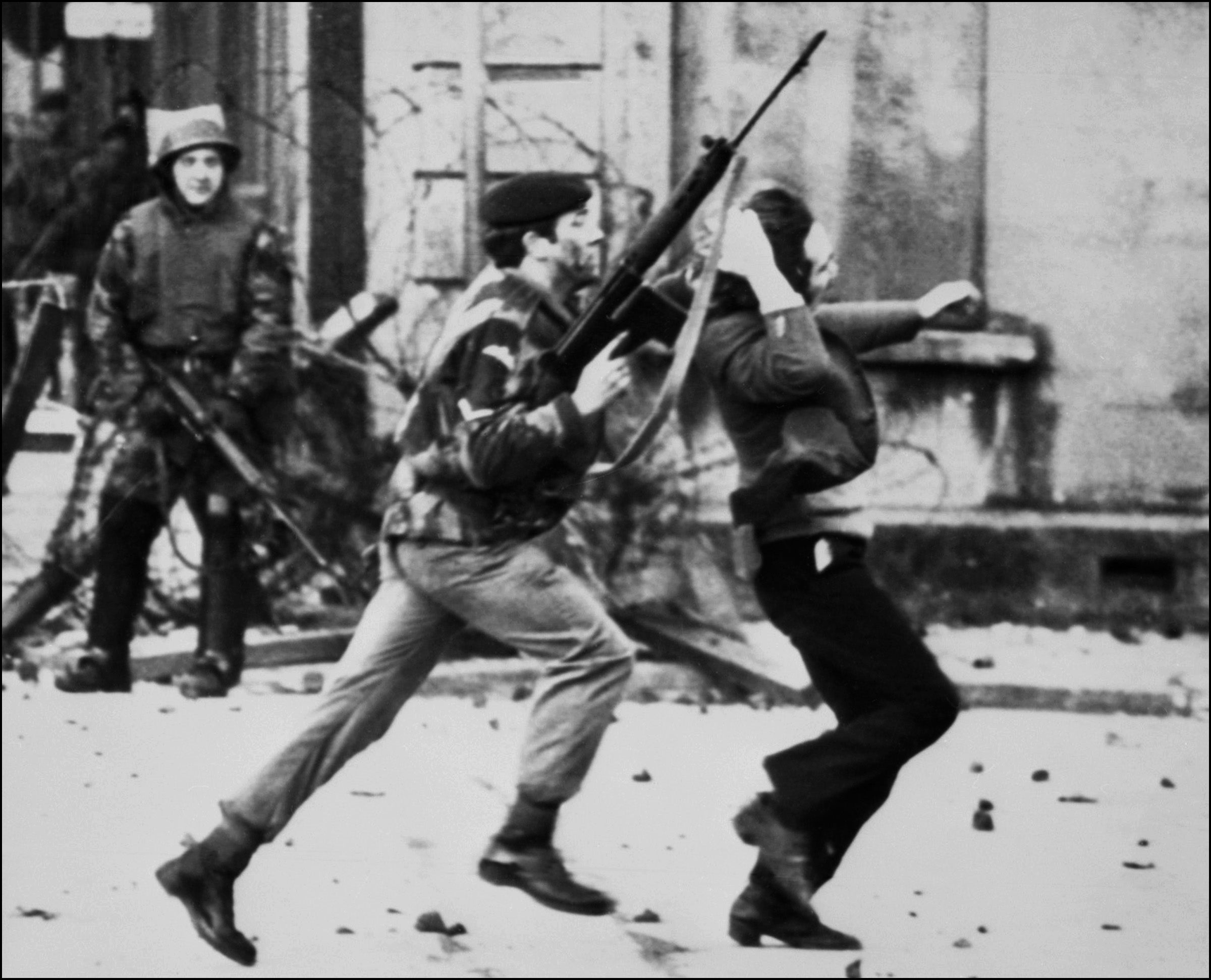 A British soldier drags a Catholic protester away during Bloody Sunday, 30 January 1972