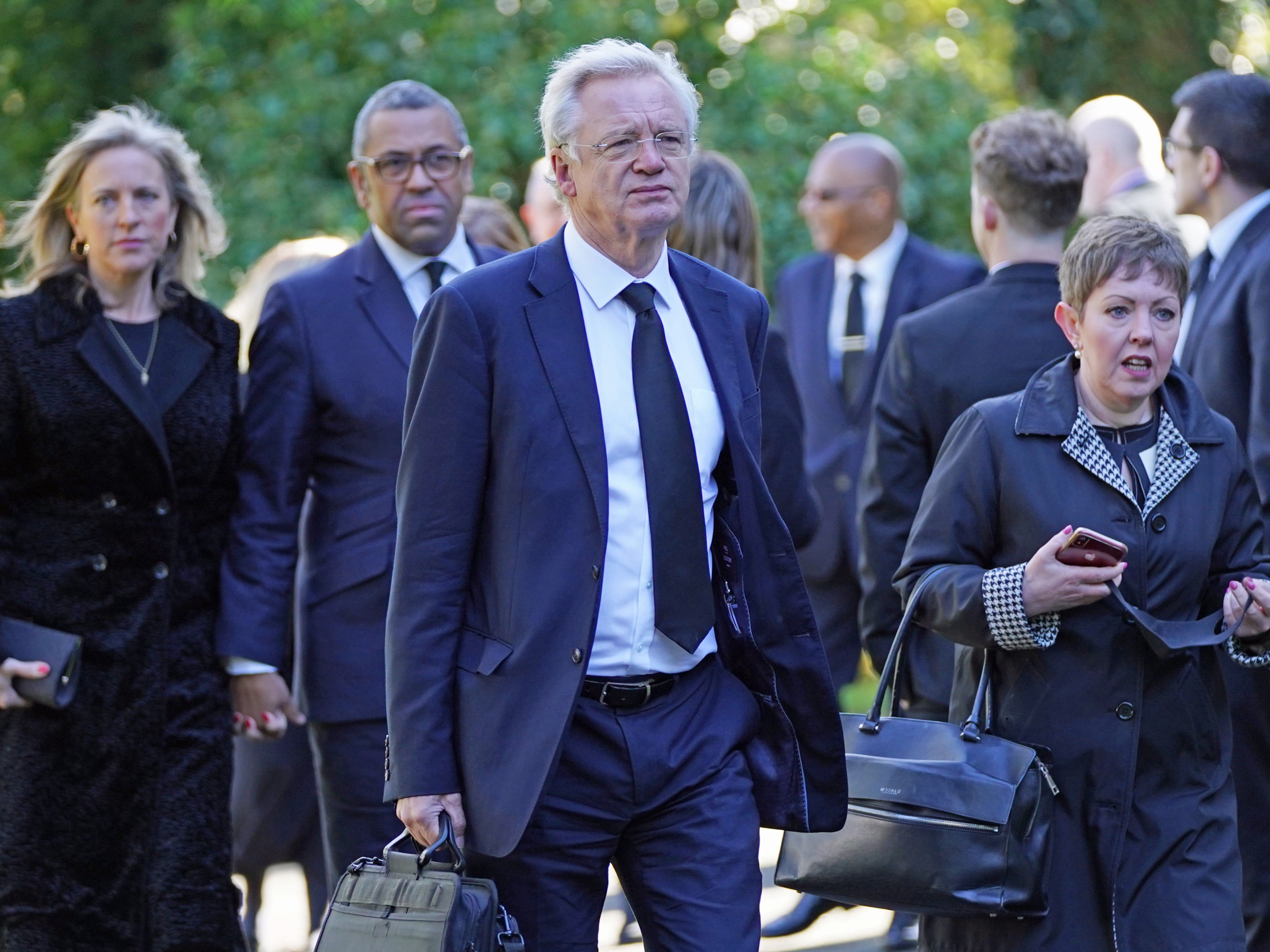 Tory MP David Davis (centre) arrives for the funeral of James Brokenshire at St John The Evangelist church in Bexley, southeast London, on Thursday