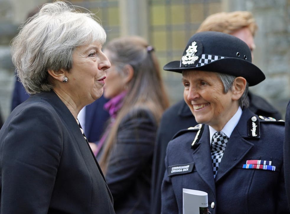 May (left) speaks to Met police commissioner Cressida Dick after the funeral