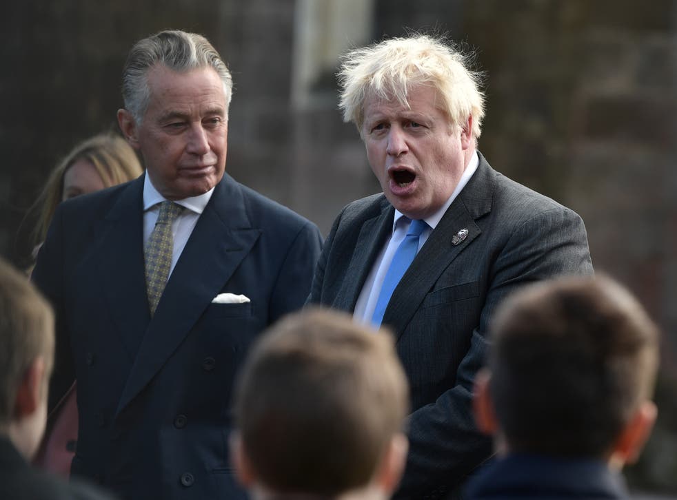 Johnson speaks with schoolchildren following the centenary of Northern Ireland at Saint Patrick’s Church of Ireland Cathedral in Armagh