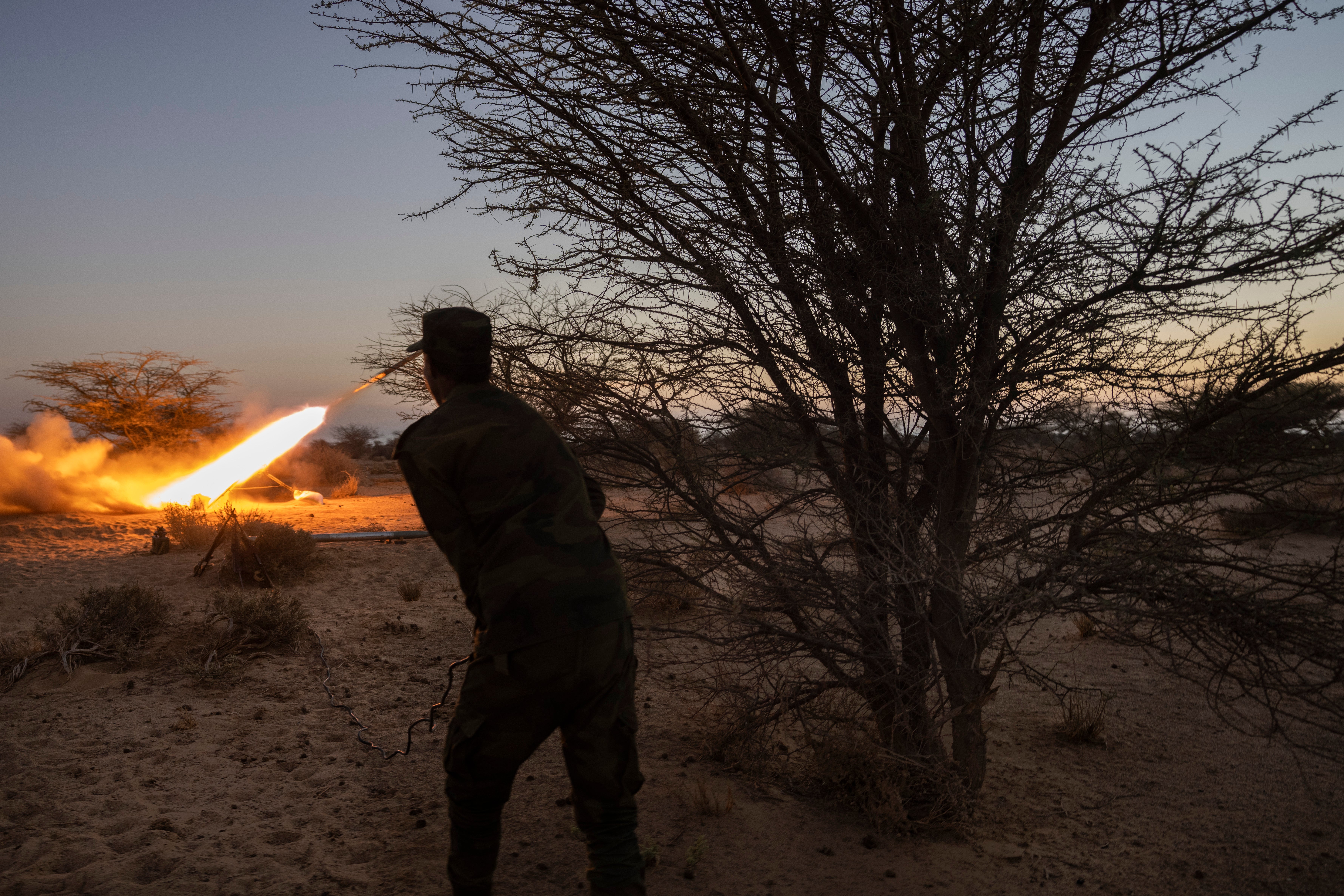 A soldier from the Polisario Front fires a rocket towards Morocco