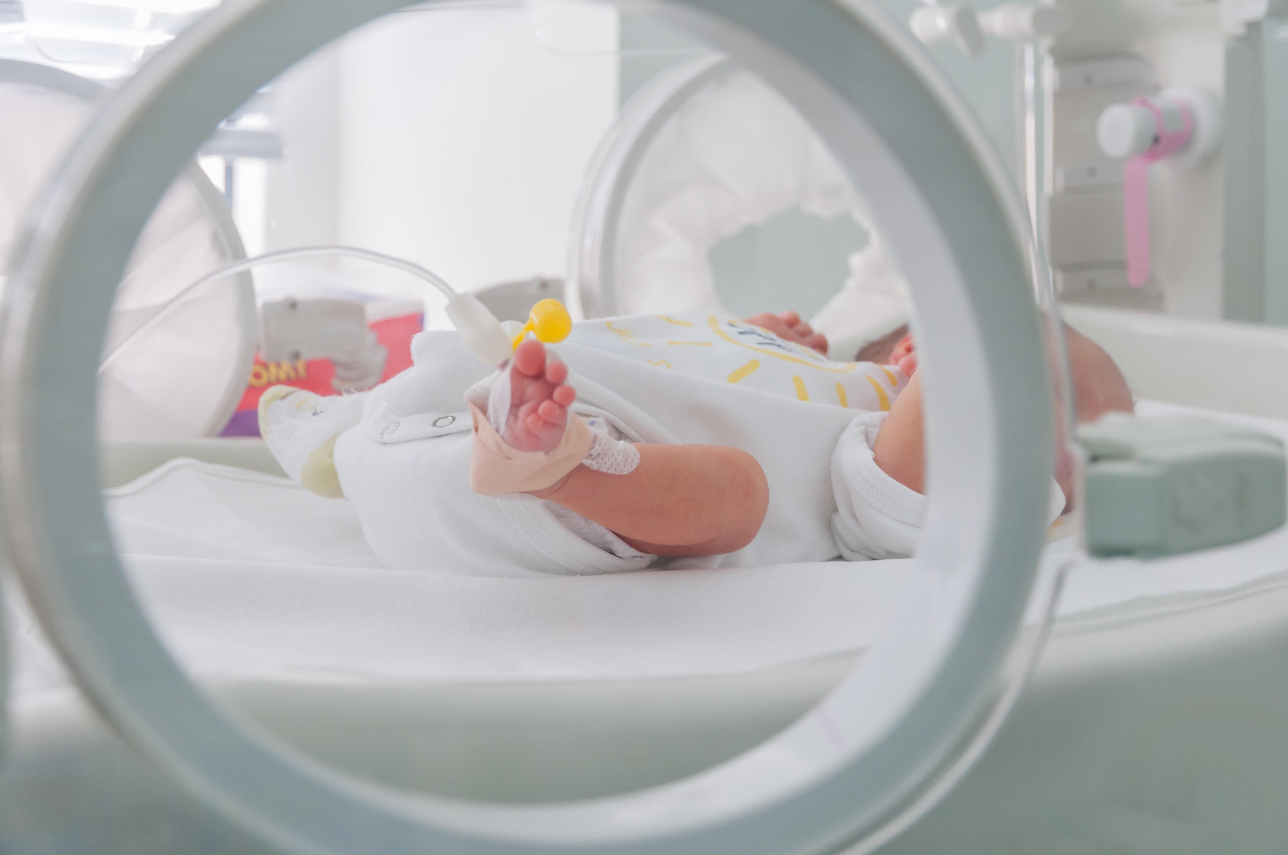 Newborn baby in an incubator (Alamy/PA)