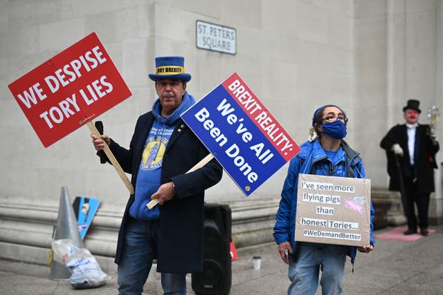 <p>Brexit blues: Steve Bray and a fellow campaigner outside the Conservative Party conference in Manchester this month </p>