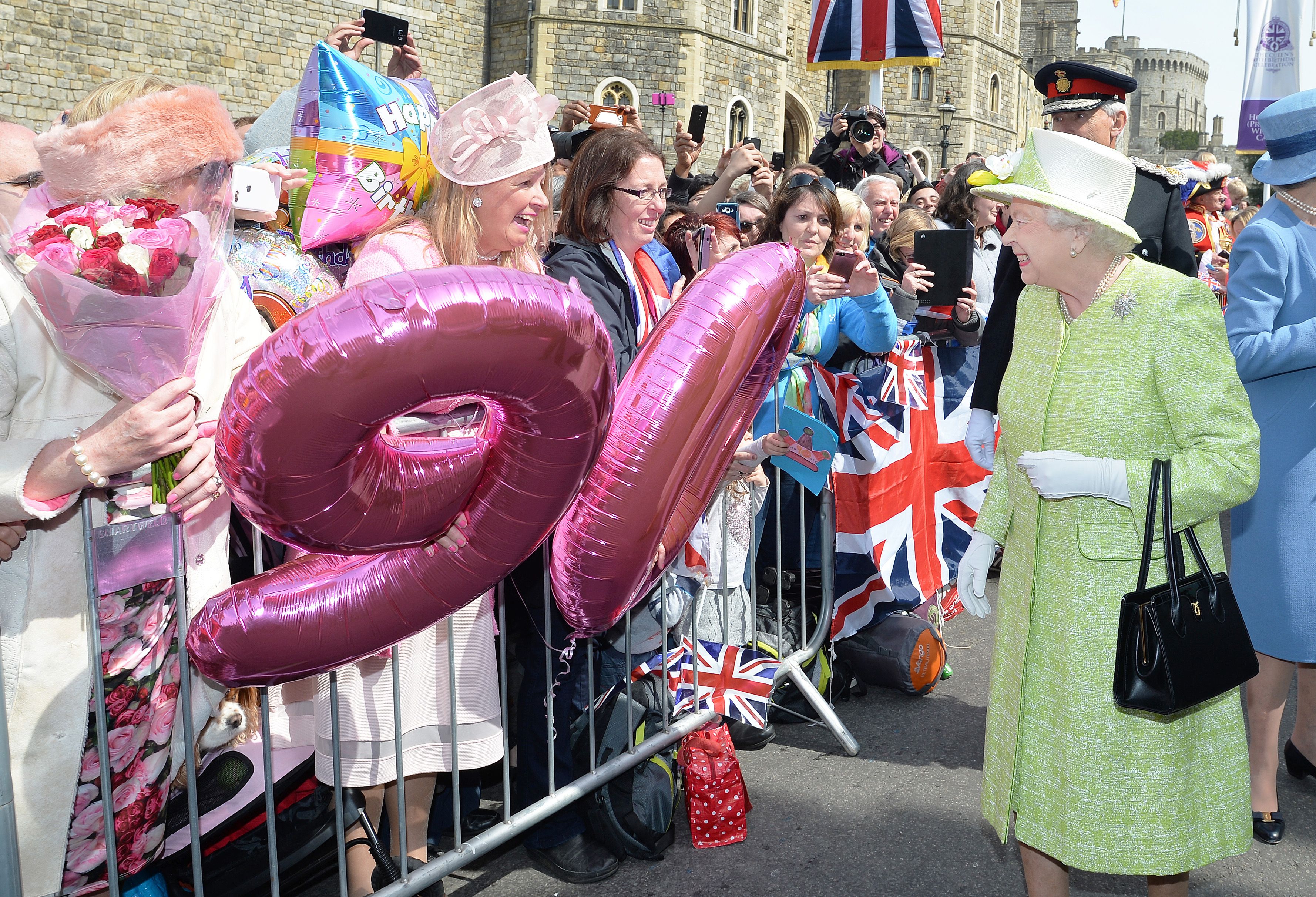 Queen Elizabeth II greets well-wishers during a 'walkabout' on her 90th birthday in Windsor in 2016