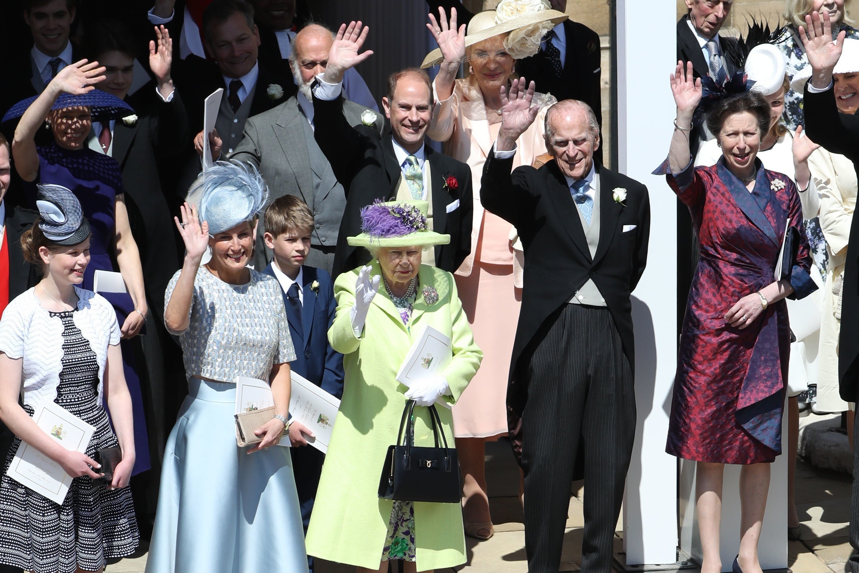 The Queen waves at Prince Harry and Meghan after their wedding in 2018