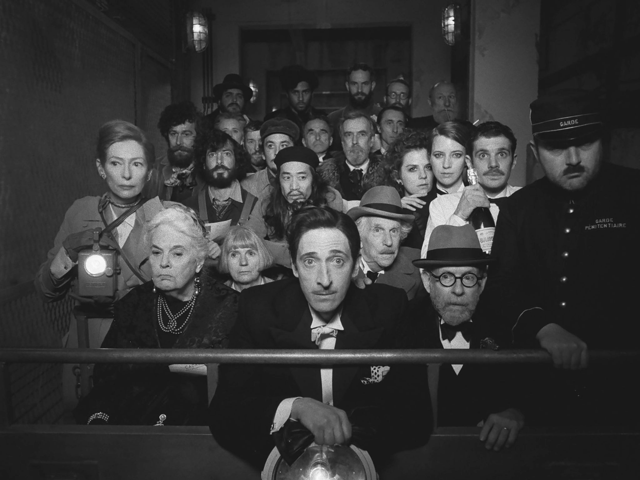 <p>Tilda Swinton, Lois Smith, Adrien Brody, Henry Winkler, Bob Balaban and others in ‘The French Dispatch'</p>