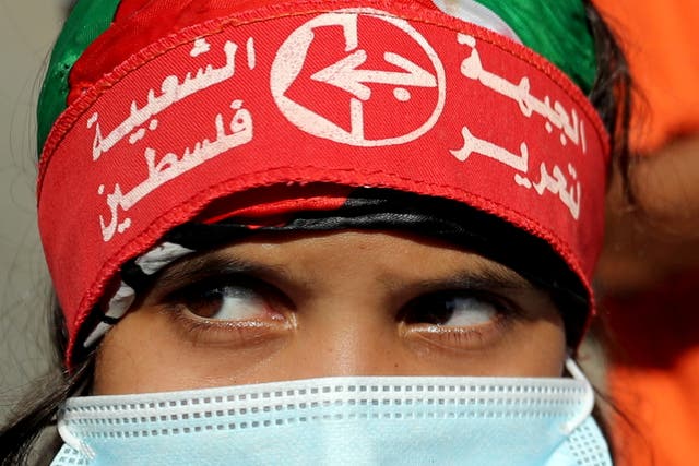 <p>A girl wearing a headband of the Popular Front for the Liberation of Palestine </p>