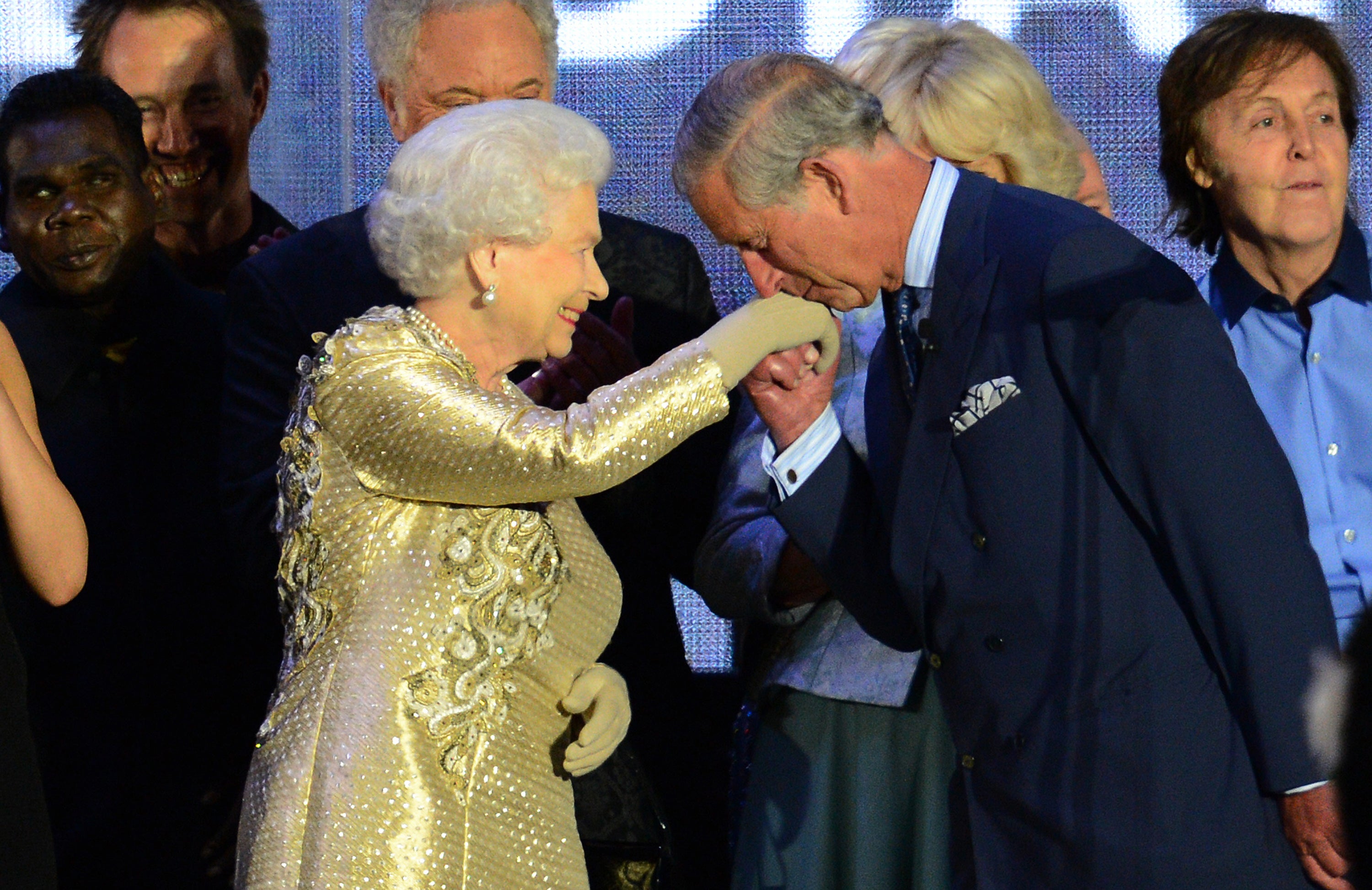 Britain's Prince Charles kisses the hand of his mother Queen Elizabeth at the end of her Diamond Jubilee concert in front of Buckingham Palace in London, 2012
