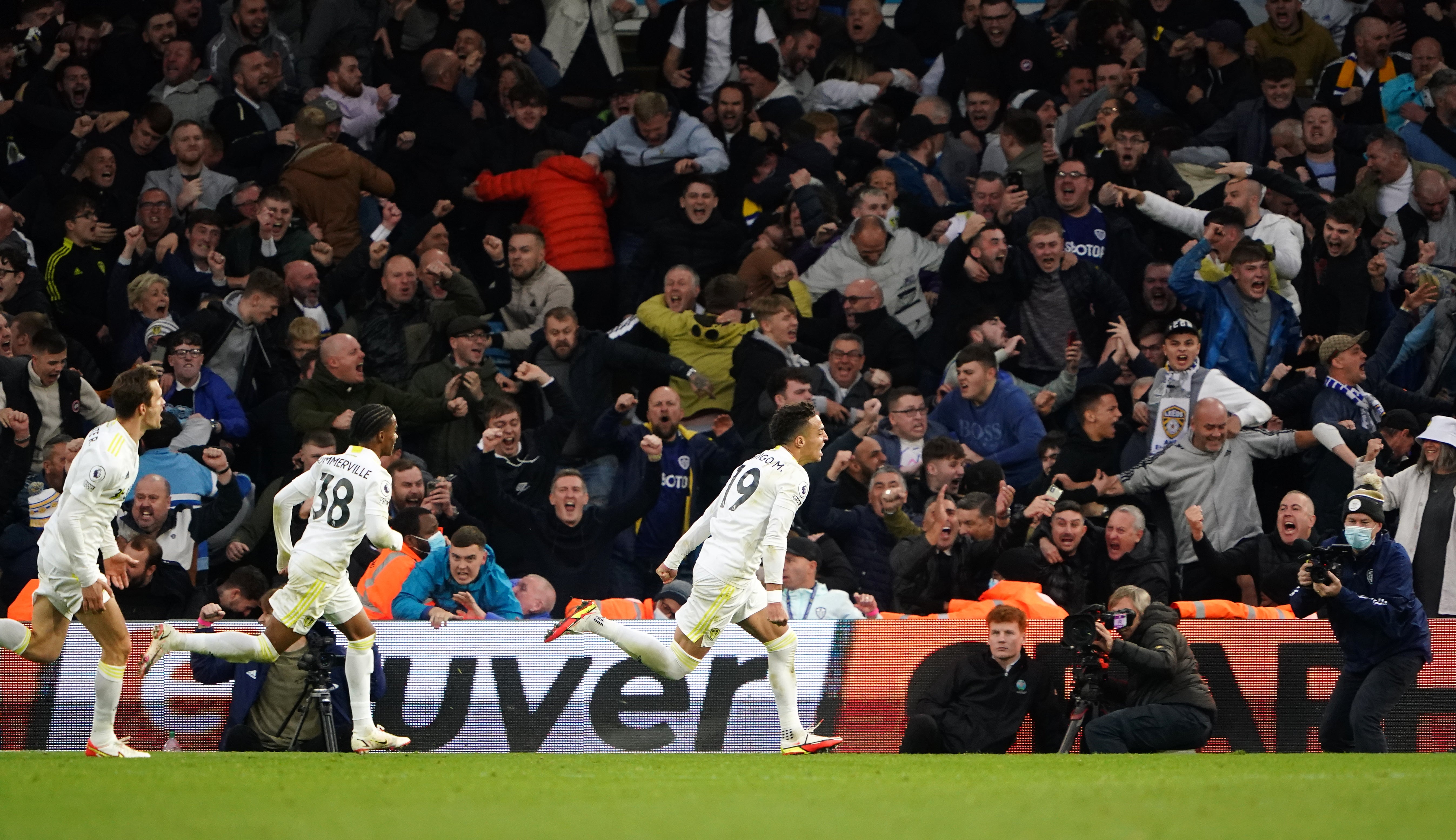 Rodrigo, right, celebrates his equaliser in front of the Leeds fans (Zac Goodwin/PA)