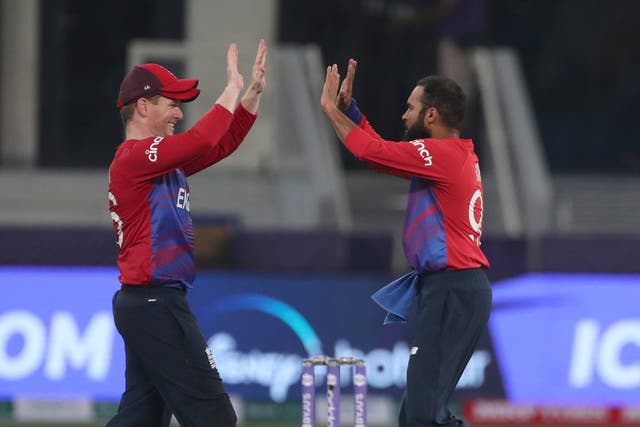 Eoin Morgan (left) and Adil Rashid celebrate a wicket in the win over West Indies (Aijaz Rahi/AP).