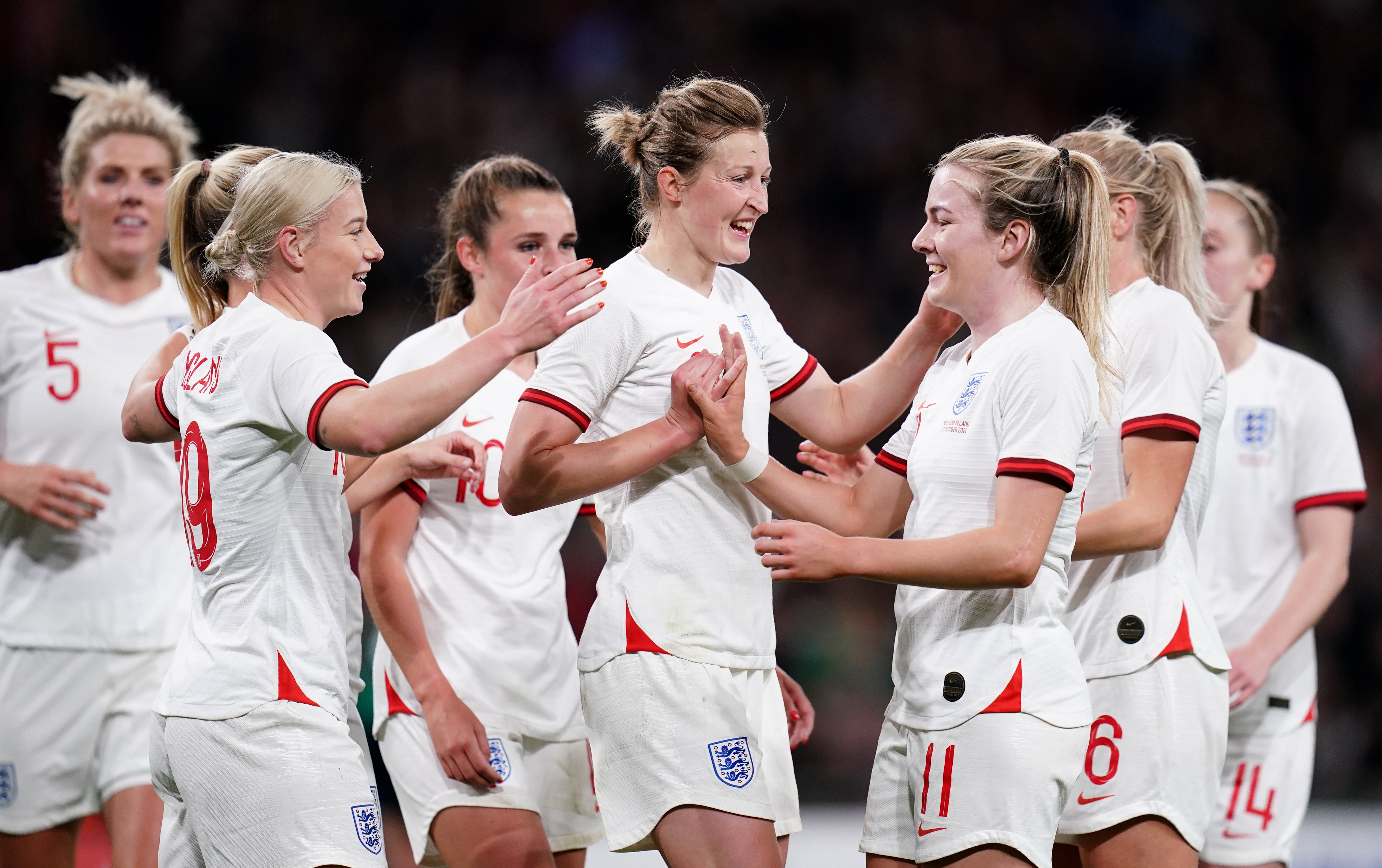 Bethany England, left, celebrates after getting the final touch