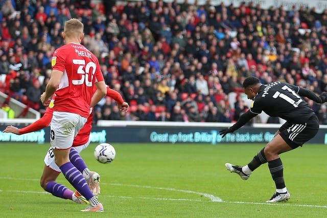 Sheffield United’s Lys Mousset (right) scores the first of his two goals in a 3-2 win at Barnsley (Nigel French/PA Images).