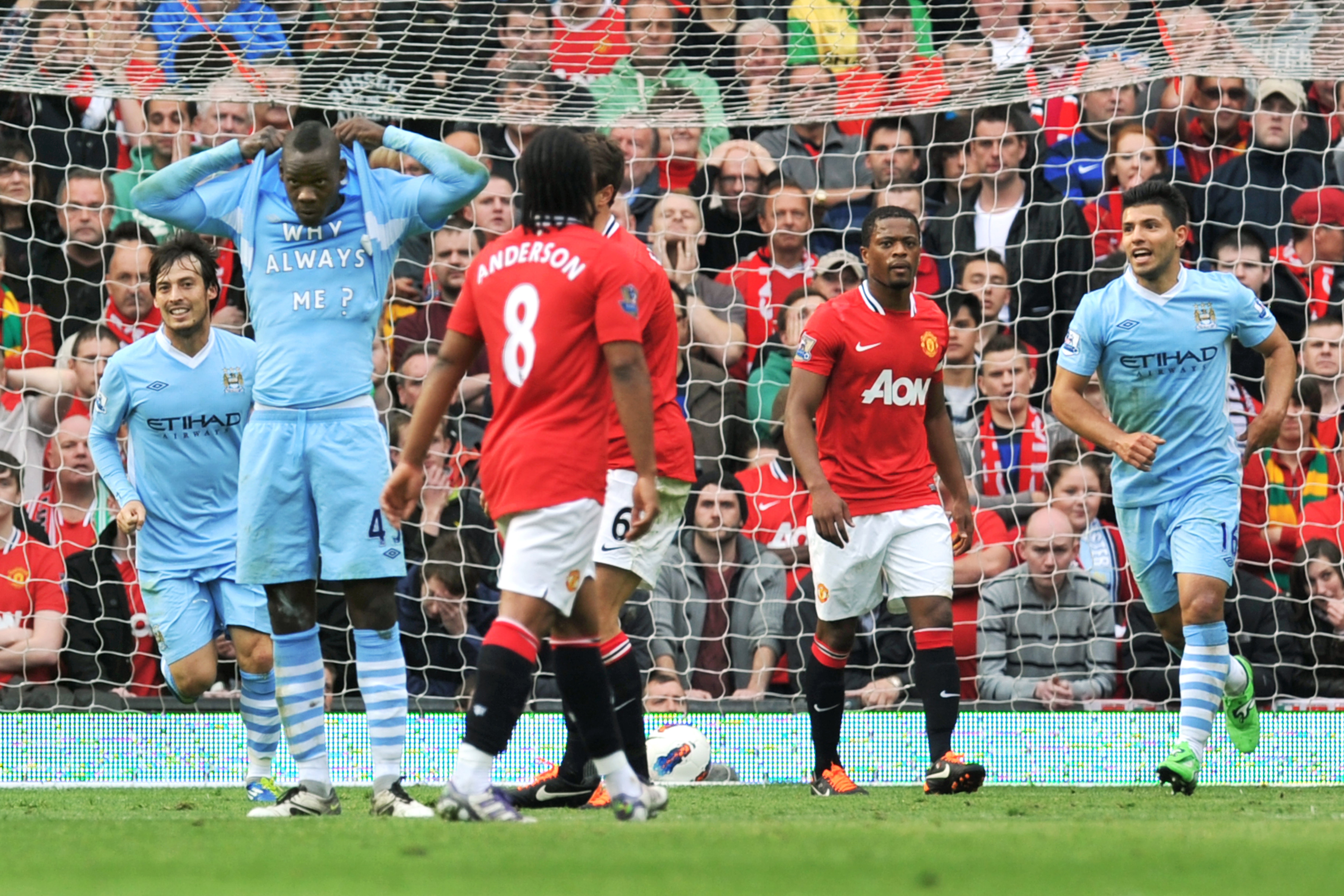 Manchester City’s Mario Balotelli (second left) shows off a T-shirt after scoring in a 6-1 victory at Old Trafford (Martin Rickett/PA)