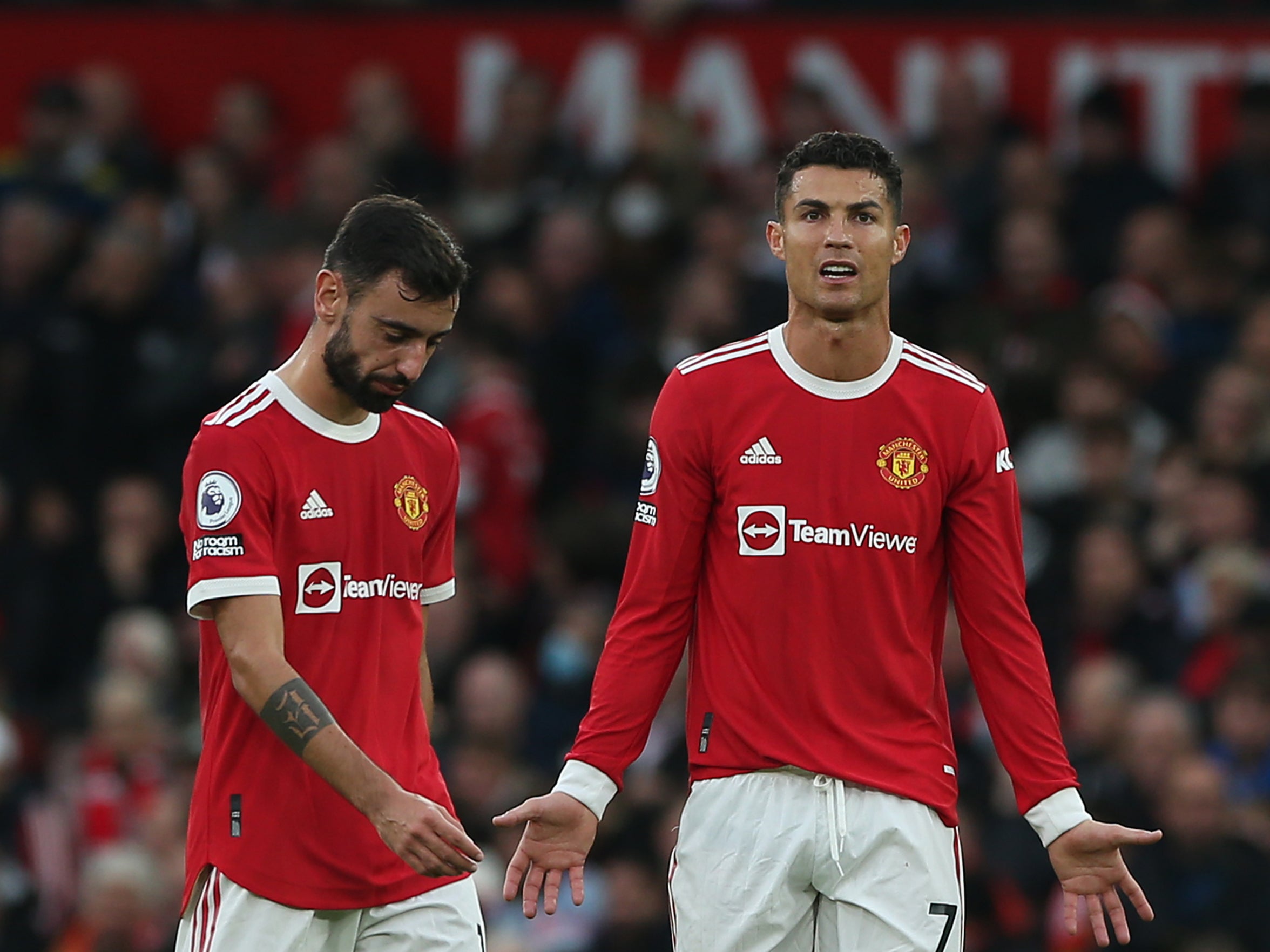 Bruno Fernandes (left) and Cristiano Ronaldo react to their side’s thrashing by Liverpool