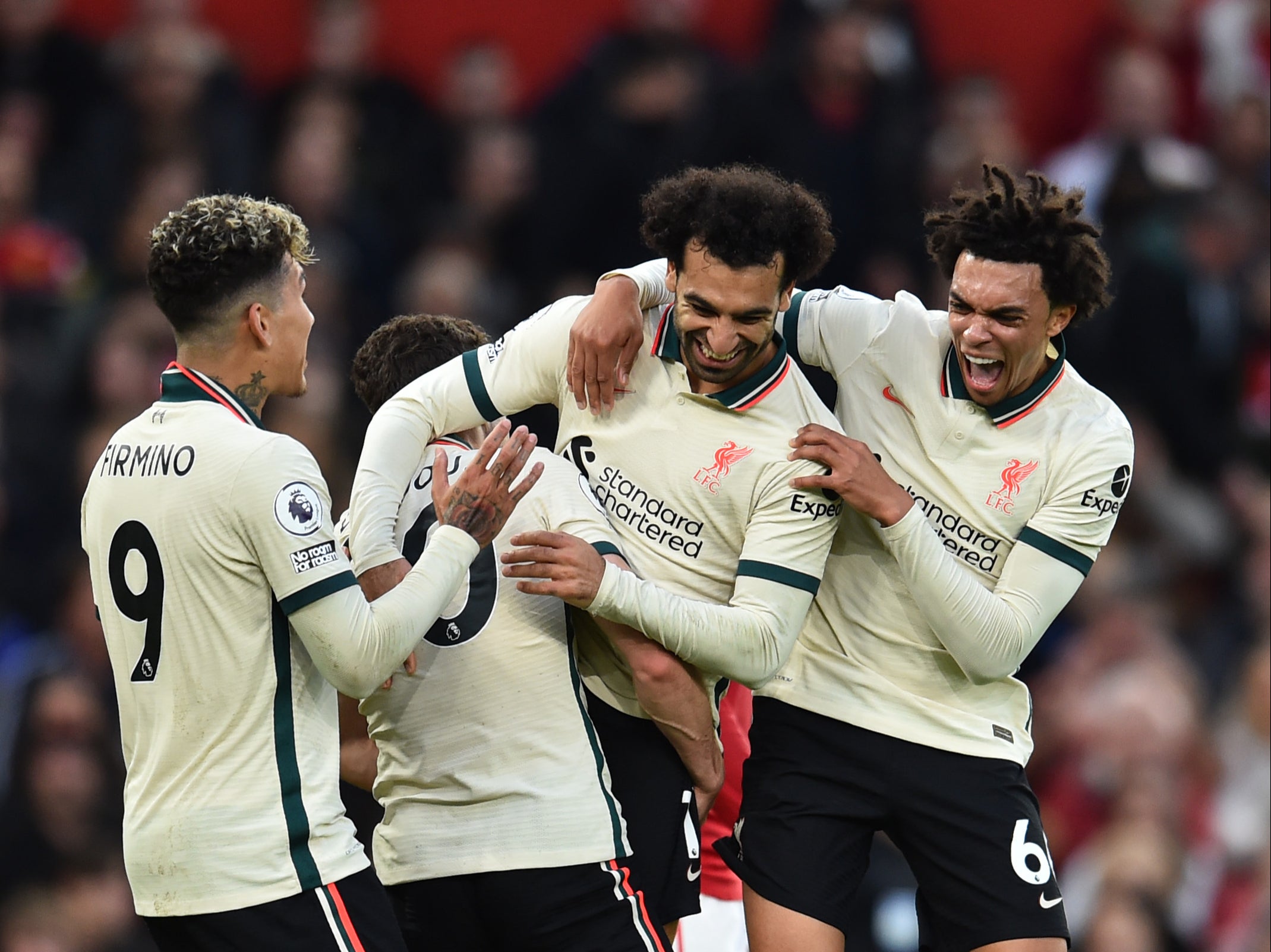Mohamed Salah is mobbed by his Liverpool colleagues after completing his hat-trick