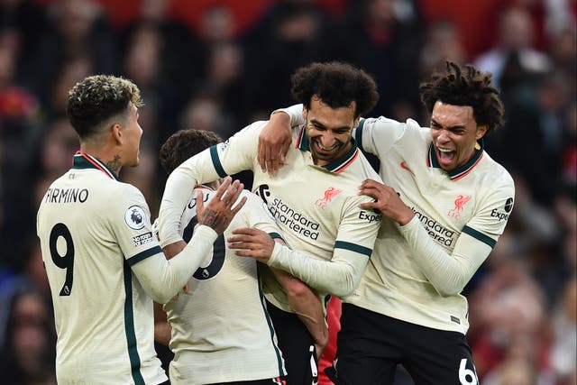 <p>Liverpool players celebrate after Mohamed Salah (second right) nets his third goal</p>