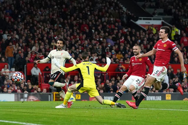 <p>Liverpool’s Mohamed Salah (left) scored a hat-trick in the 5-0 win (Martin Rickett/PA)</p>