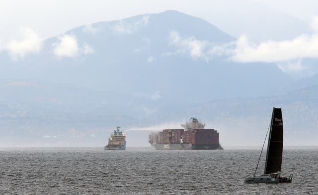 <p>Ships work to control a fire onboard the MV Zim Kingston about eight kilometres from the shore in Victoria, British Columbia</p>