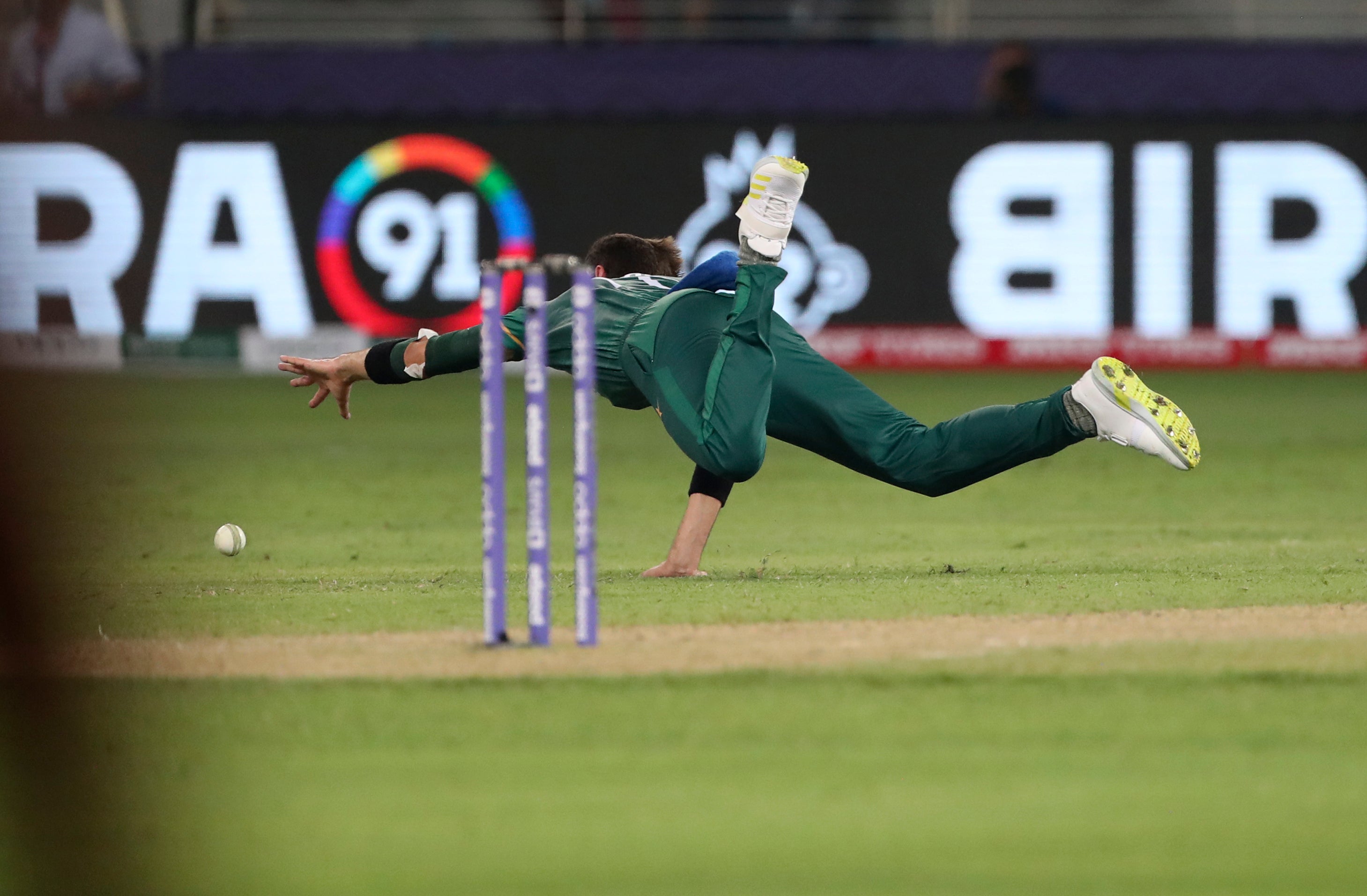 Pakistan’s Shaheen Afridi dives to field the ball during his side’s T20 World Cup win over India (Aijaz Rahi/PA)