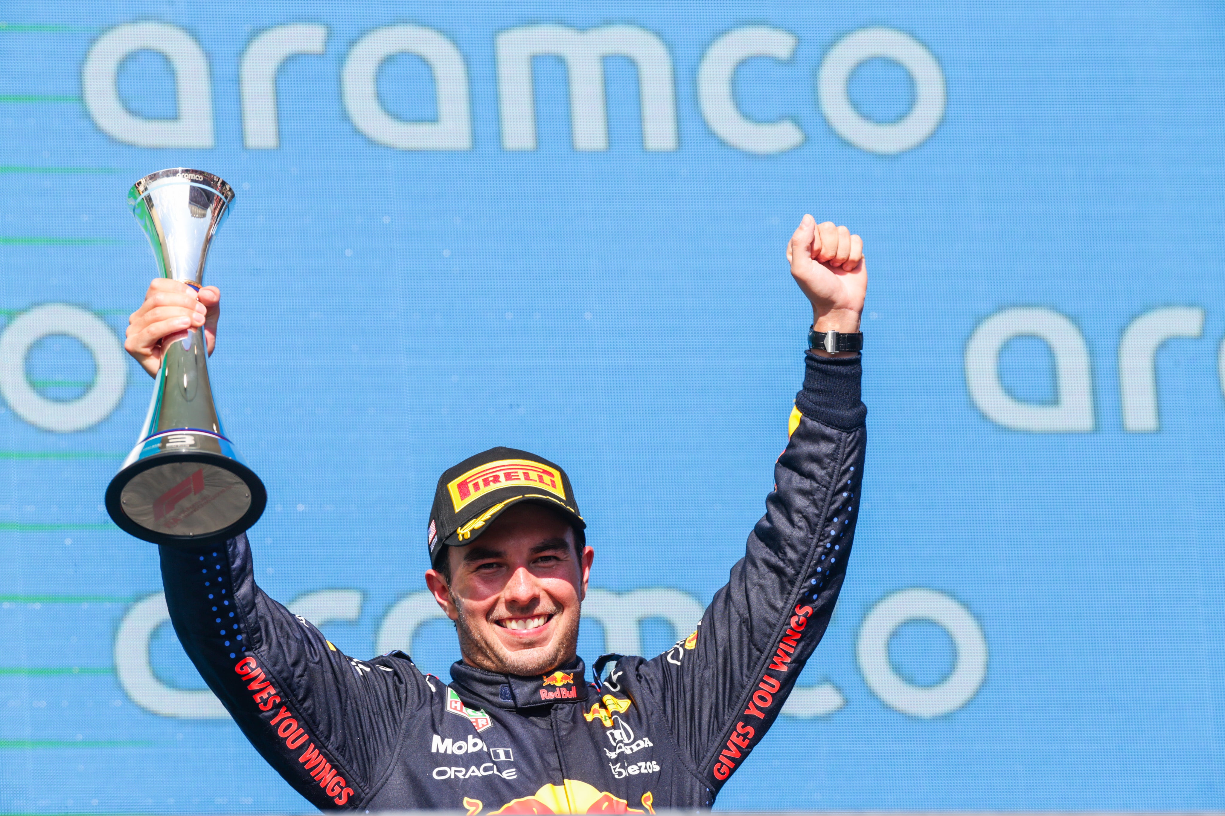Sergio Perez of Mexico and Red Bull Racing celebrates finishing in third position
