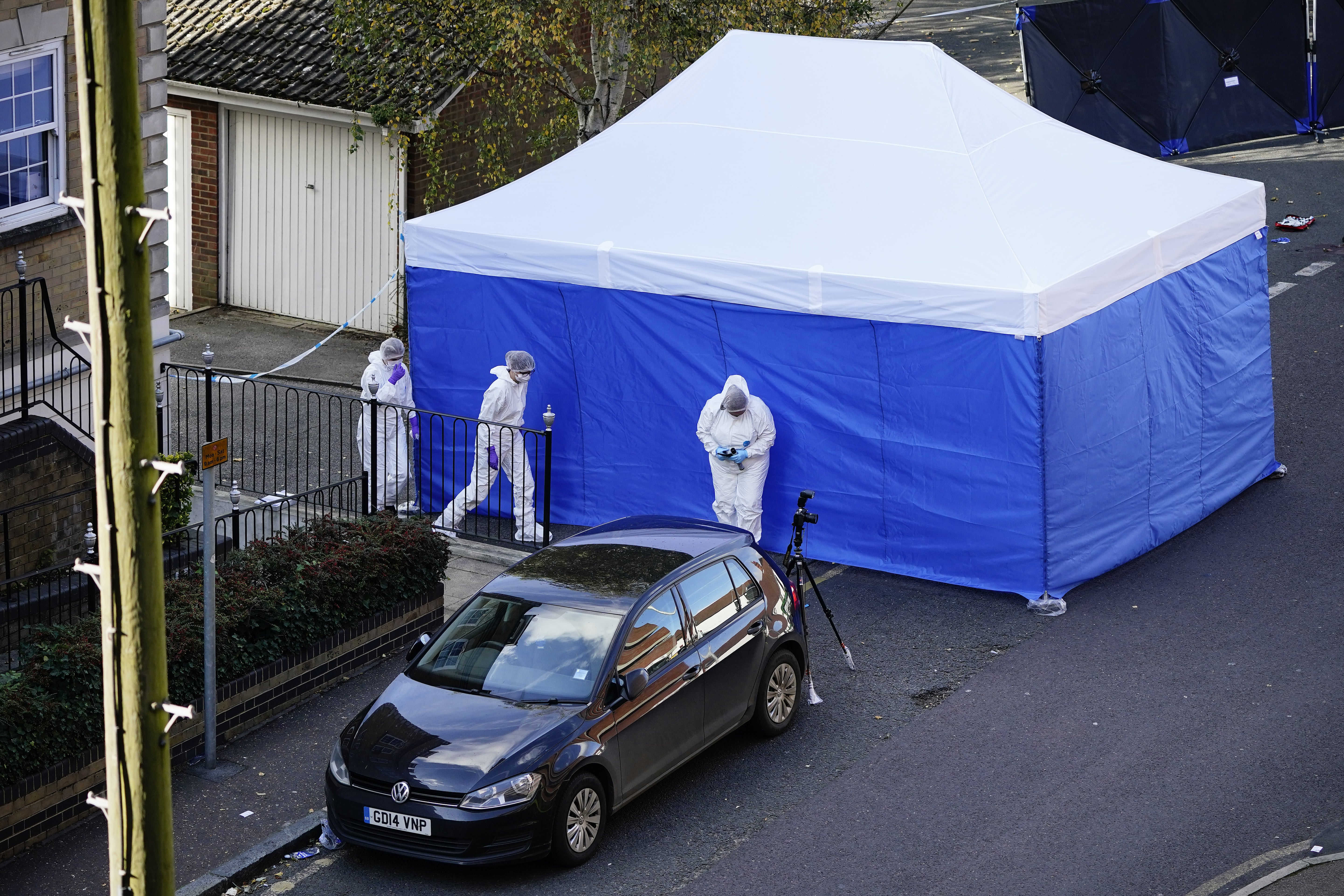 Investigators at the scene on Regency Court, Brentford