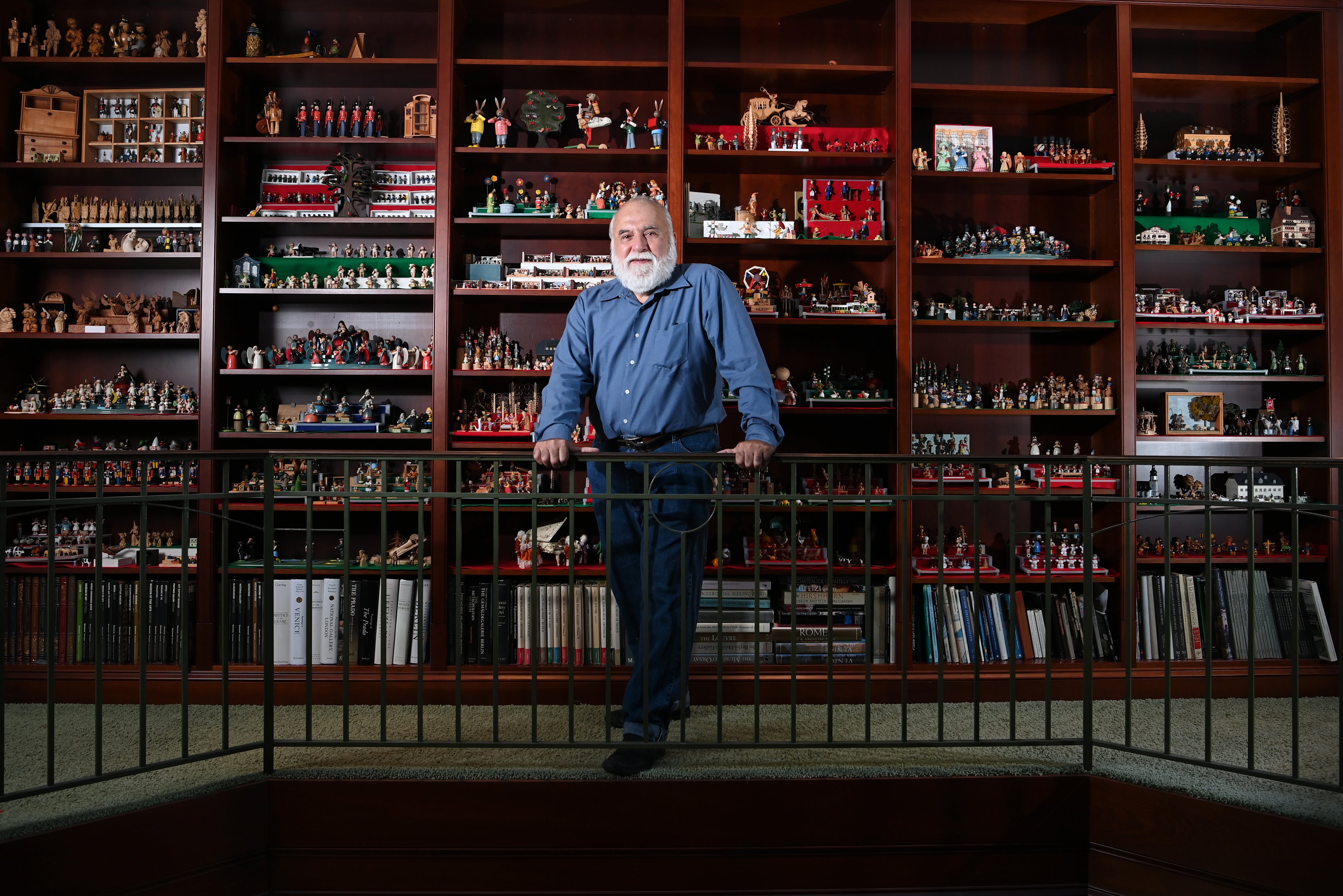 <p>Jorge Flores in front of a portion of his miniature collection at his home in Potomac</p>