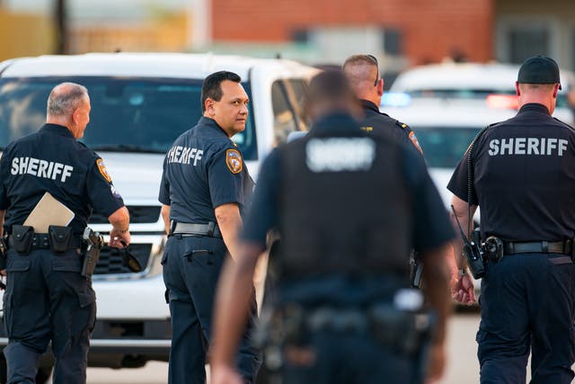 <p>Harris County Sheriff Ed Gonzalez and other deputies on the scene at an apartment complex where the skeletal remains of a child were found Sunday </p>