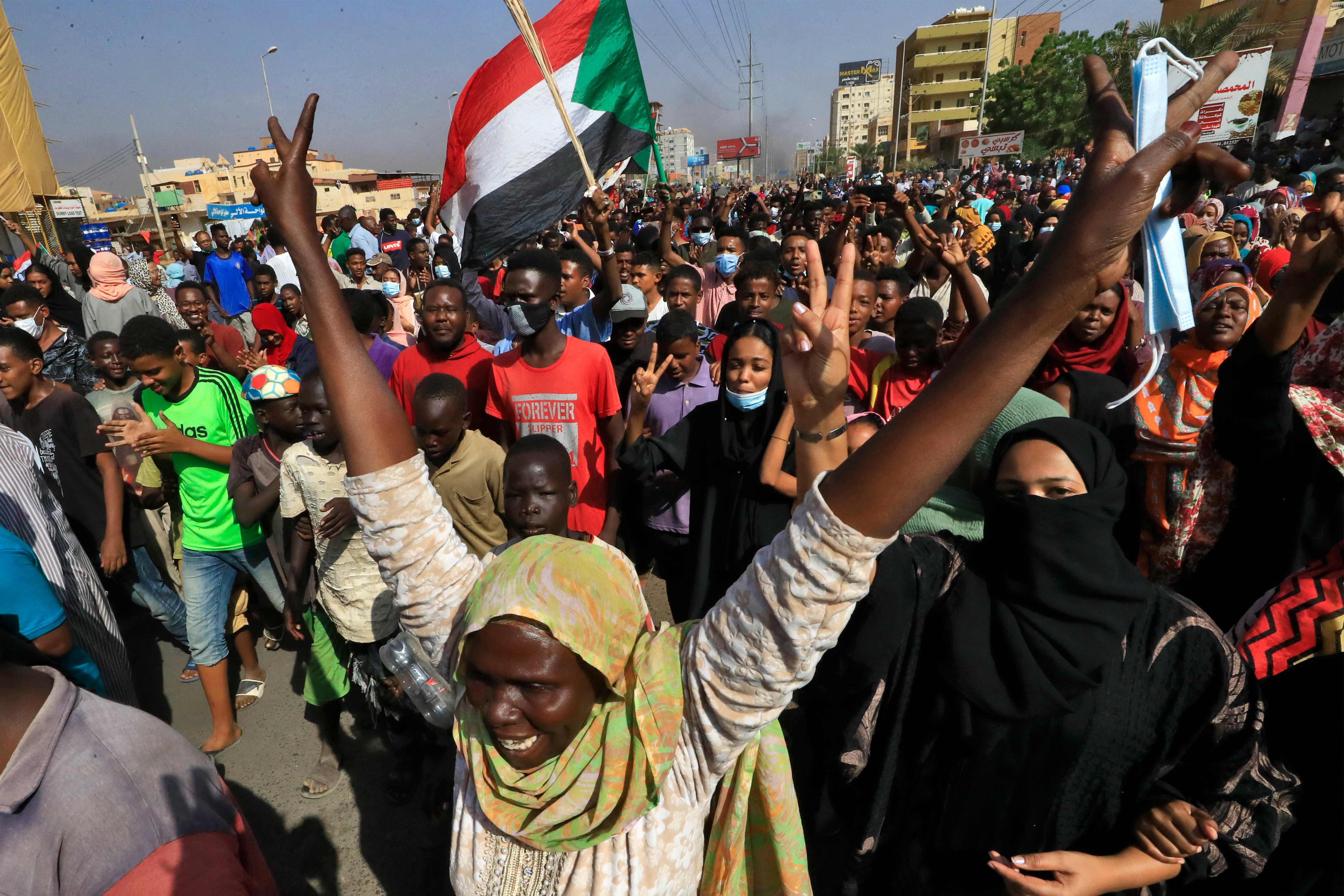 Protesters barricaded streets and chanted in support of civilian rule