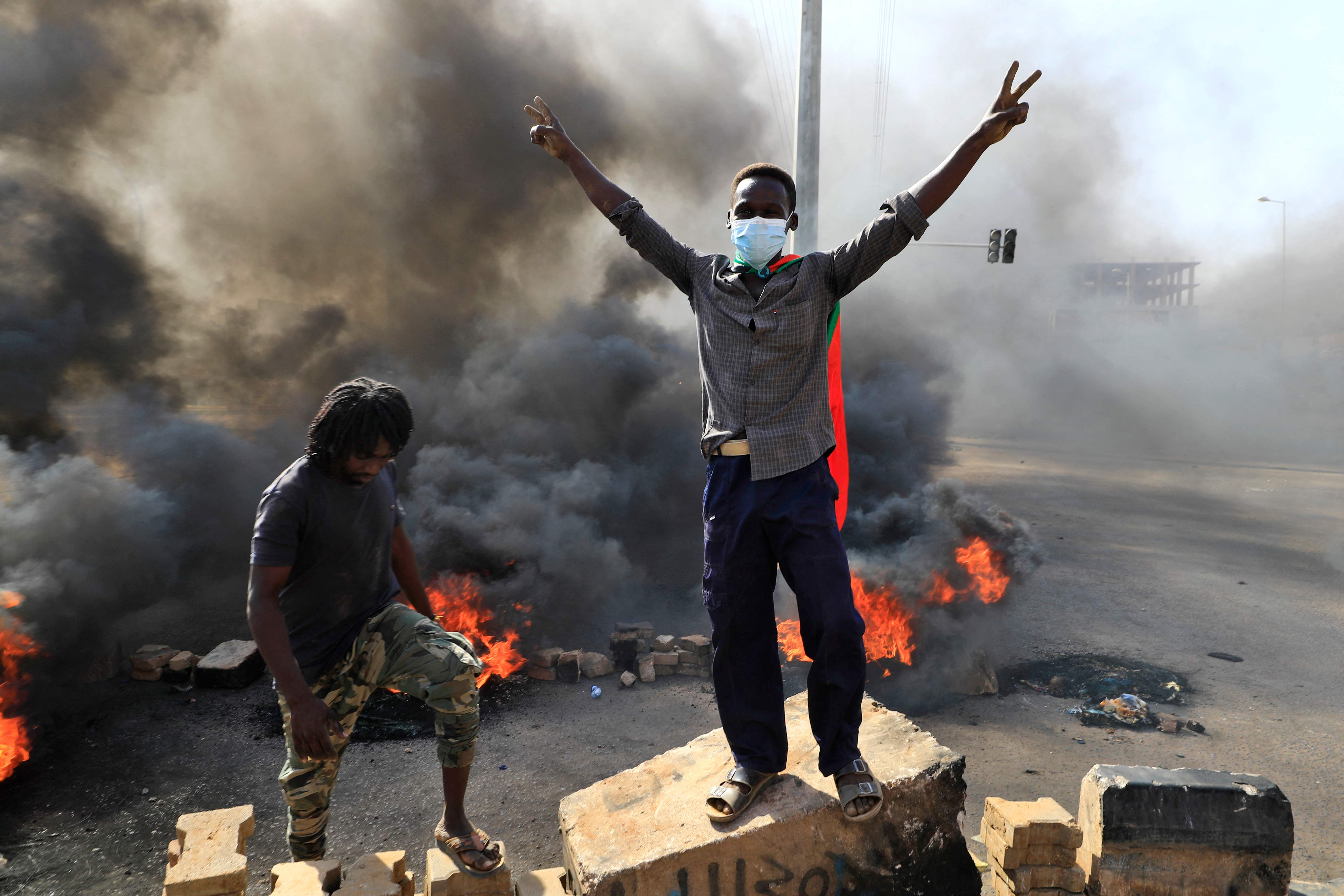 <p>Protesters burn tyres to block a road in the capital Khartoum on Monday, denouncing overnight detentions by the army of members of Sudan’s government </p>
