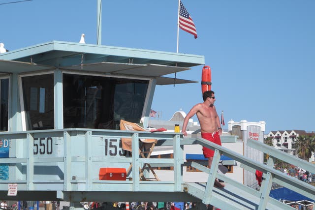 <p>Waiting game: a lifesaver on the beach at Santa Monica, California</p>