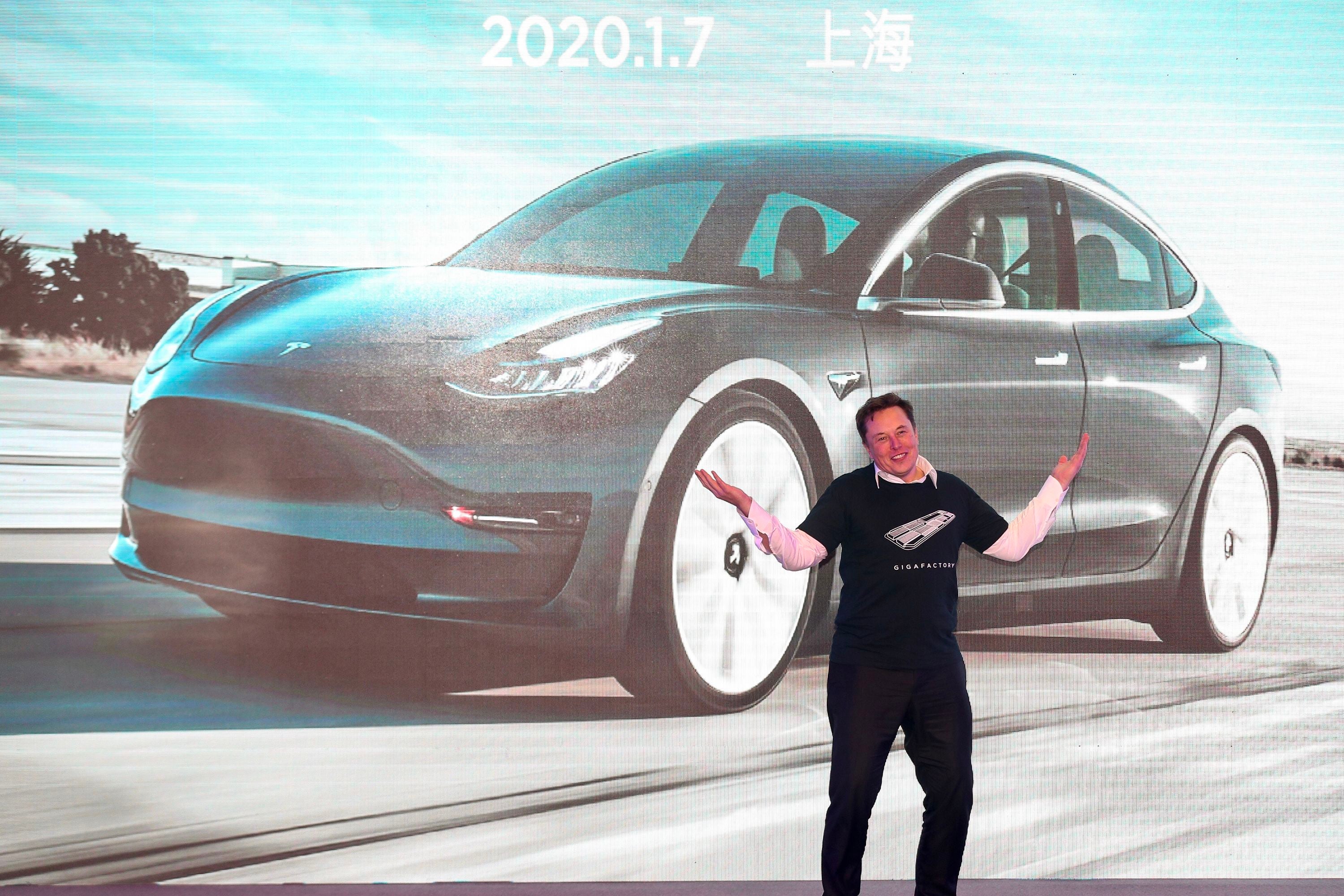 Tesla chief Elon Musk gestures during the Tesla China-made Model 3 Delivery Ceremony in Shanghai