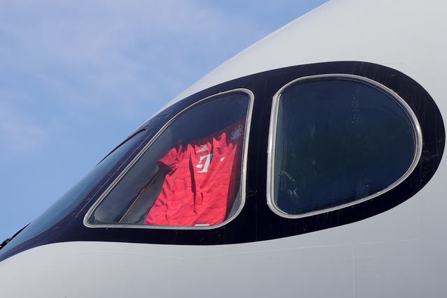 <p>A Bayern shirt is displayed in the cockpit window of a Qatar Airways plane during a preseason tour</p>