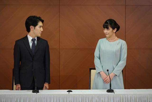 <p>Japan’s Princess Mako and her husband Kei Komuro address a press conference announcing the registration of their marriage on Tuesday </p>