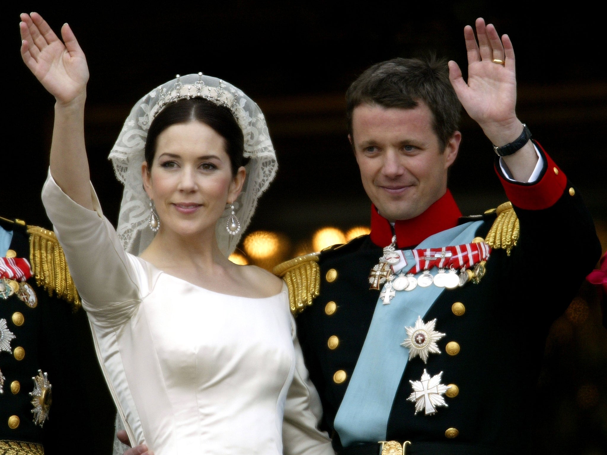 Crown Princess Mary and Crown Prince Frederik of Denmark wave from the balcony of Christian VII’s Palace after their wedding on 14 May, 2004 in Copenhagen, Denmark