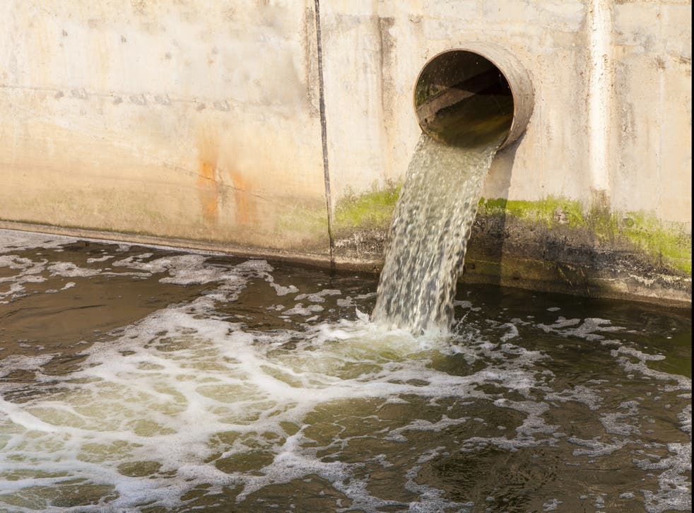 <p>Dirty water being discharged into a river</p>