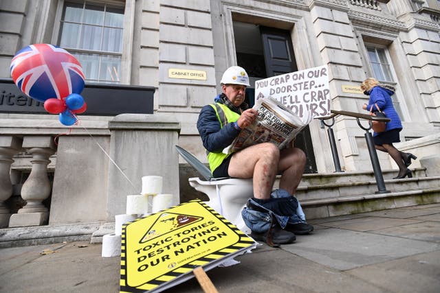 <p>Smash the cistern: protester Steve Bray sits on a toilet outside Whitehall on Wednesday </p>
