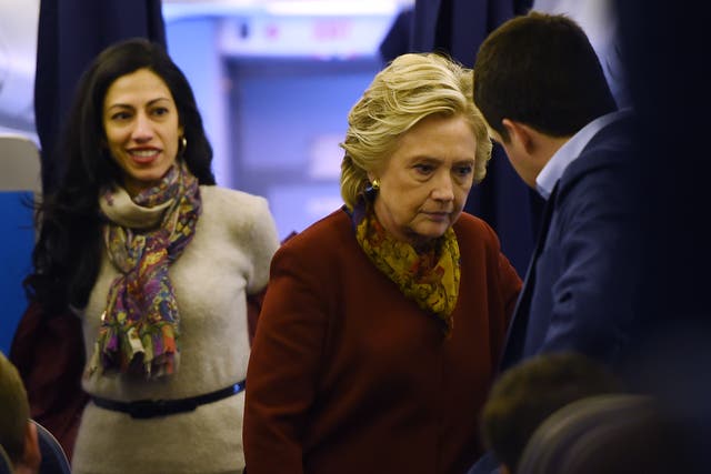 <p>Democratic presidential nominee Hillary Clinton chats with her staff, including aide Huma Abedin (L), onboard her plane in White Plains, New York, October 22, 2016, on her way to a campaign event in Pittsburgh, Pennsylvania.</p>