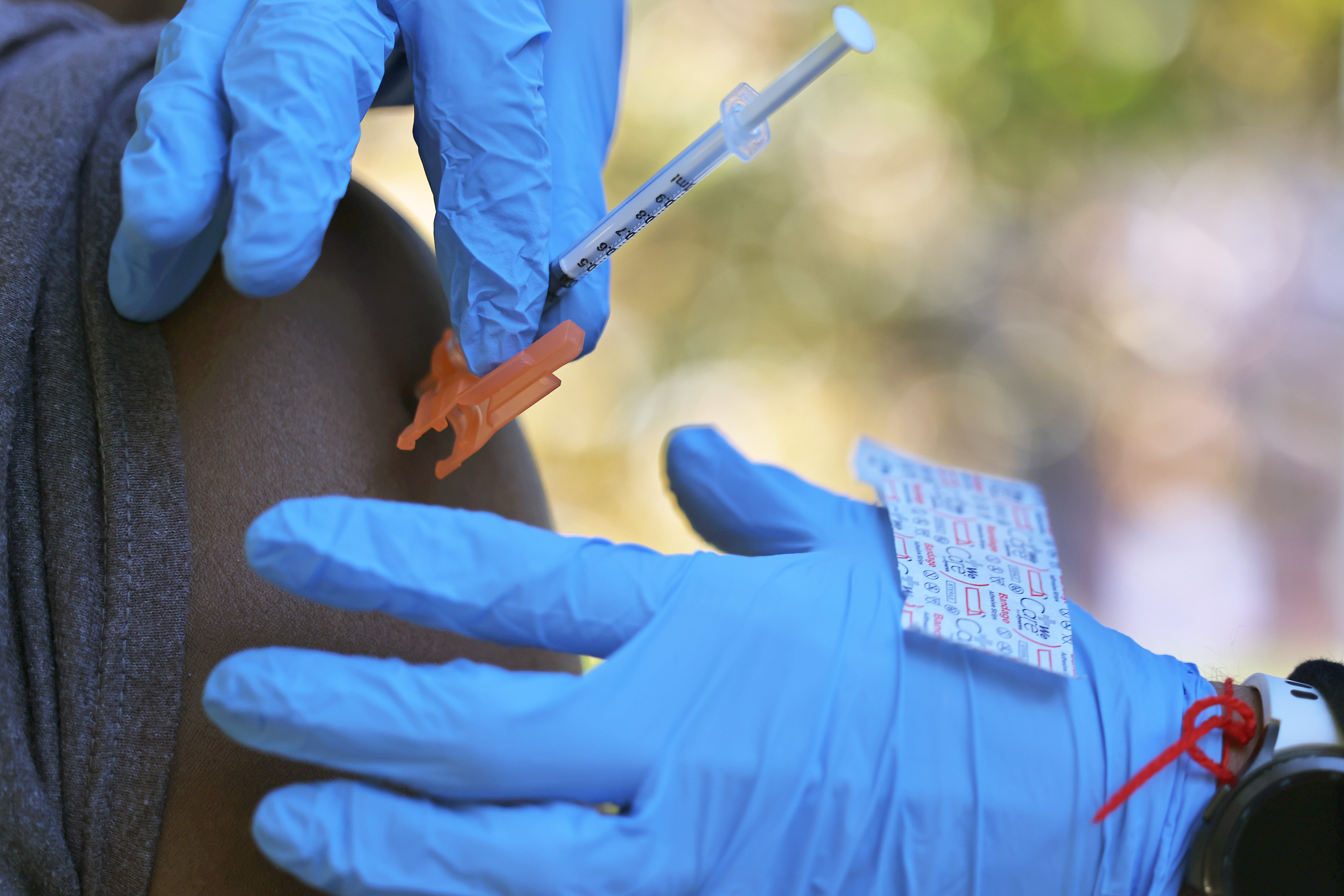 A person receives the Pfizer-BioNTech coronavirus vaccine at a site at Life of Hope Center on 21 October 2021 in New York City