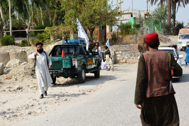 <p>File photo: Taliban members inspect near the site of a blast carried out by the Isis in Jalalabad on 18 September</p>