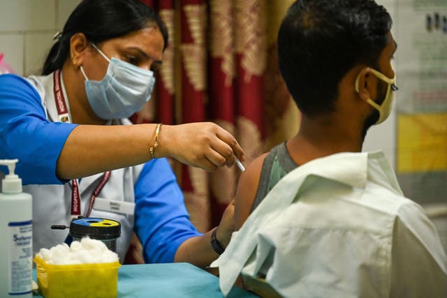 <p>File. A health worker inoculates a man with a dose of the Covaxin vaccine against the Covid-19 coronavirus at a health centre in New Delhi on 21 October 2021  </p>