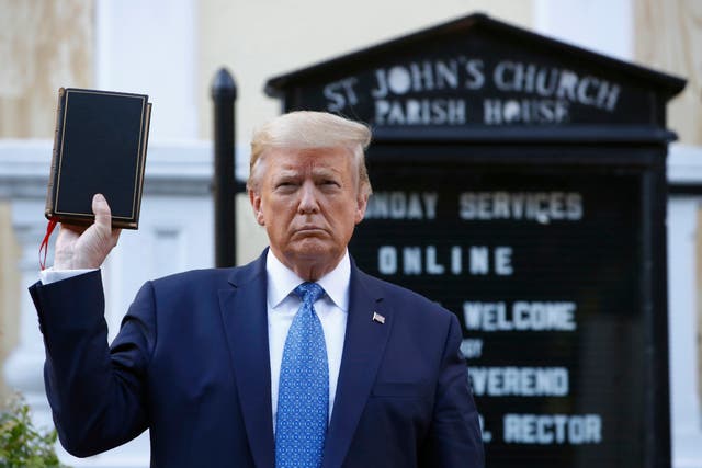 <p>Donald Trump holds a Bible outside a church in Washington DC in 2020 </p>