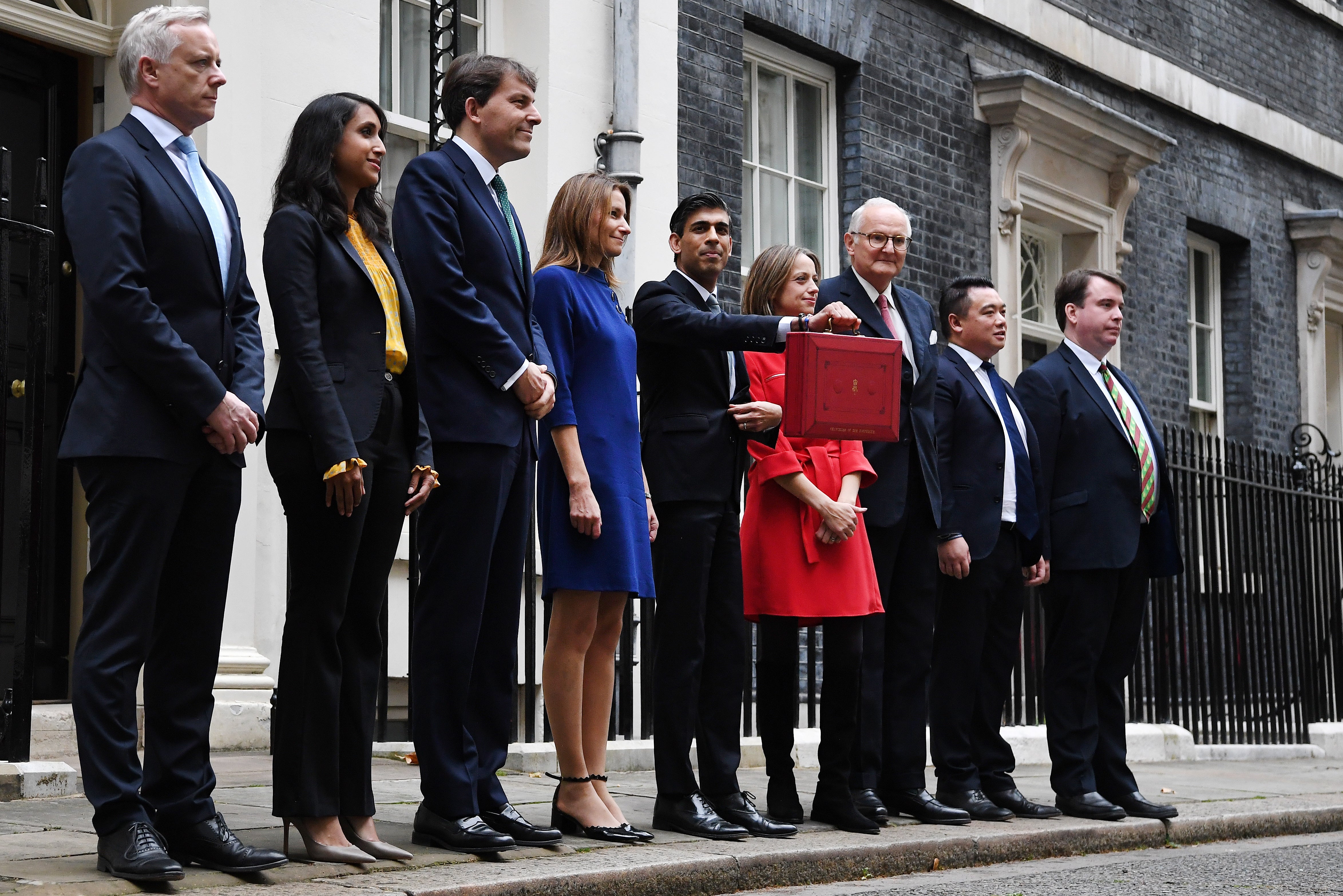 Rishi Sunak and his economic staff stand outside No 11 Downing Street with his Budget box