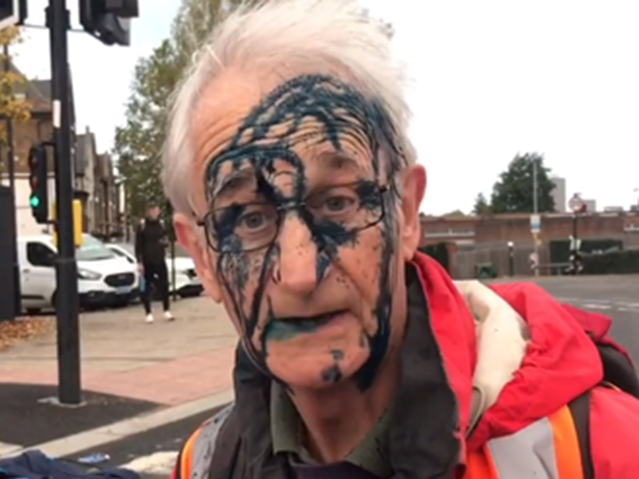 <p>Retired doctor and Insulate Britain protester, 77-year-old Christian, covered in ink by angry driver</p>