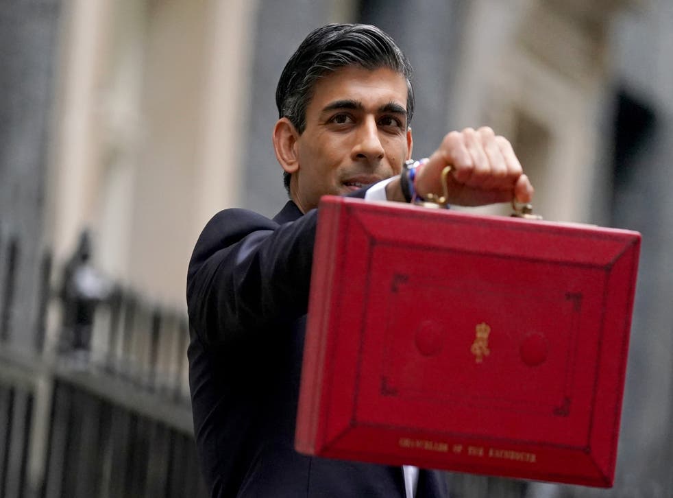 Chancellor of the Exchequer Rishi Sunak holds his ministerial ‘Red Box’ as he stands with his ministerial team and Parliamentary Private Secretaries, outside 11 Downing Street, London, before delivering his Budget to the House of Commons. Picture date: Wednesday October 27, 2021.