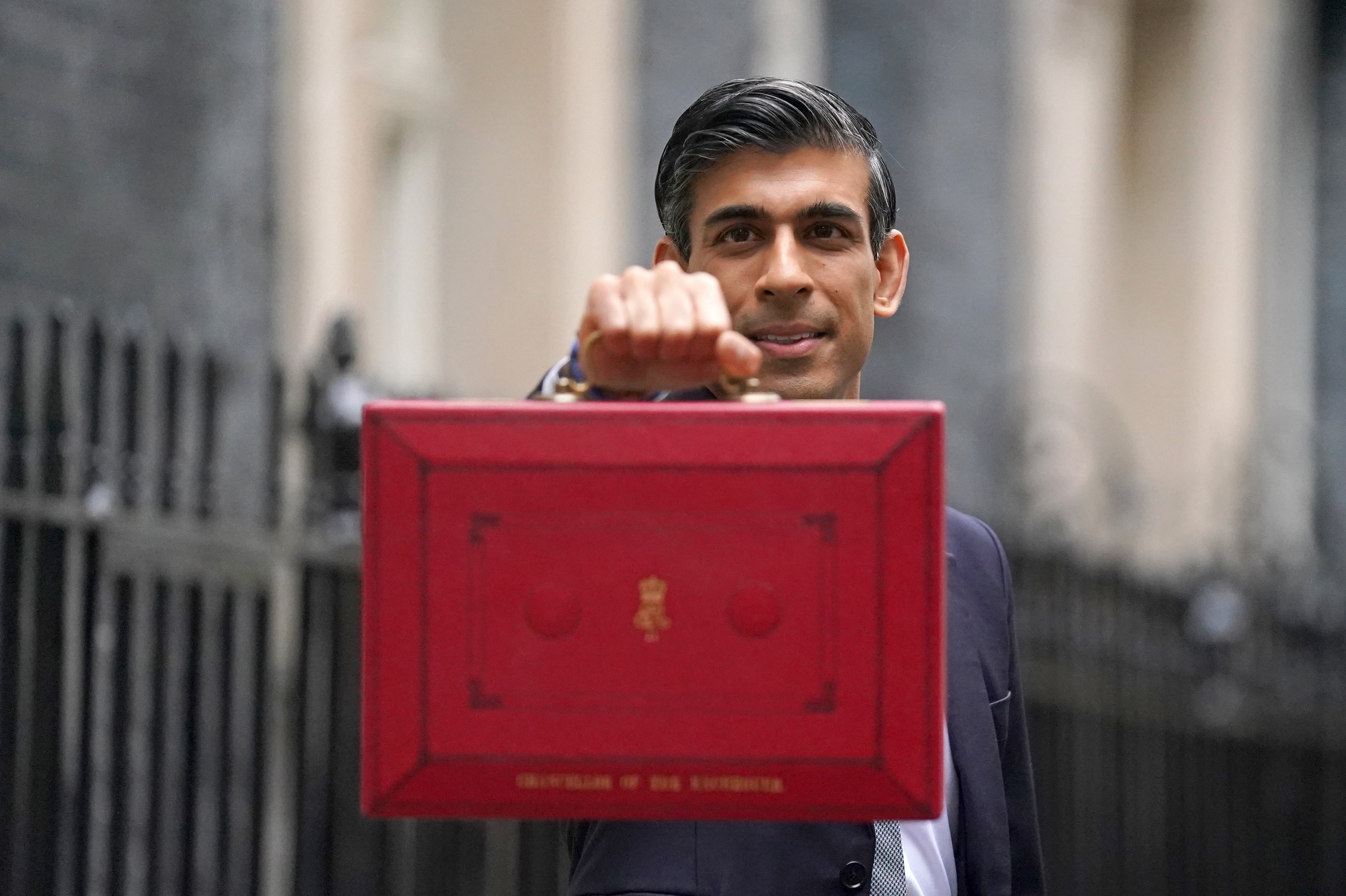 Chancellor of the Exchequer Rishi Sunak holds his ministerial ‘Red Box’ as he stands with his ministerial team and Parliamentary Private Secretaries, outside 11 Downing Street, London, before delivering his Budget to the House of Commons. Picture date: Wednesday October 27, 2021.