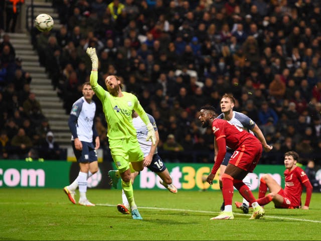 <p>Divock Origi’s backheel loops over the goalkeeper’s head </p>